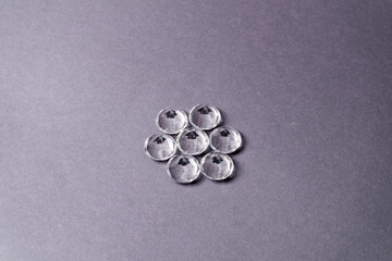 Diamonds out of Glas on a grey Background