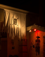 House outdoor decorated with macabre symbols on Halloween night, Temecula, California