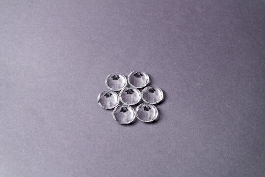Diamonds out of Glas on a grey Background