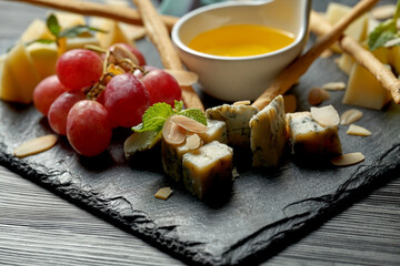 Cheese plate with different types of cheeses. Antipasti
