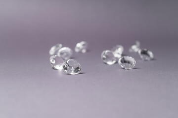 Diamonds out of Glas on a grey Background