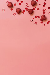 Valentines, love and wedding concept ideas. Frame red hearts on pink background. Flat lay, top view. Copy space.