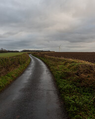 Fototapeta na wymiar road in the field after the rain in England
