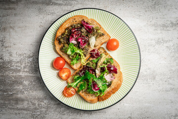 toast with avocado. vegetarian breakfast. Vegan or Vegetarian Toast with mashed avocado, arugula served