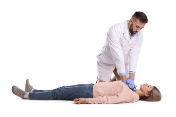Doctor in uniform performing first aid on unconscious woman against white background