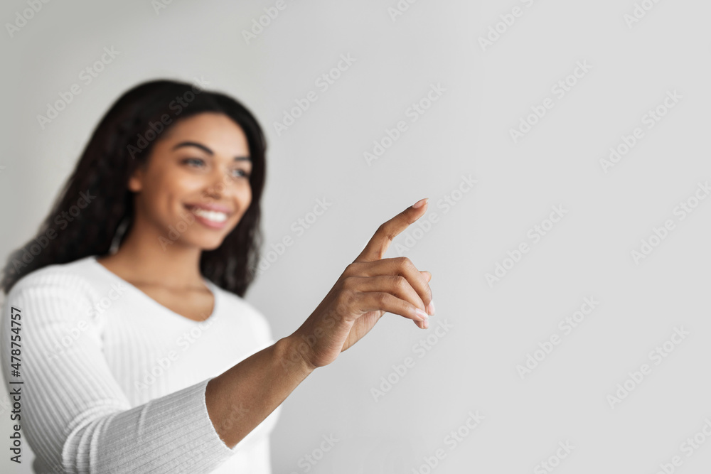 Poster smart home interface concept. african american woman pointing finger up in the air pushing button on