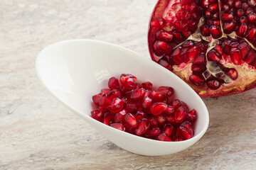 Ripe red Pomegranate seeds in the bowl