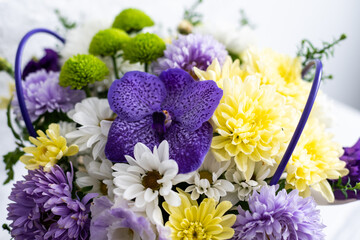 Fototapeta na wymiar bouquet of purple and white flowers on white background.
