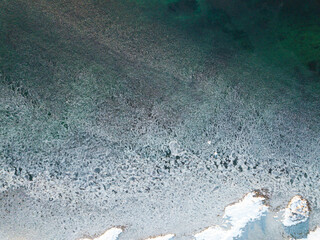 Aerial drone view on ice floes on ocean surface in Norways arctic sea