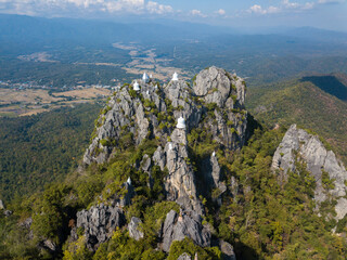 Beautiful view of the sky pagodas on limestone mountains in Wat Chaloem Phra Kiat Phrachomklao Rachanusorn in Lampang province of Thailand.