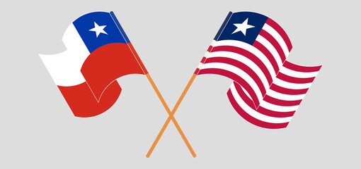 Crossed and waving flags of Chile and Liberia