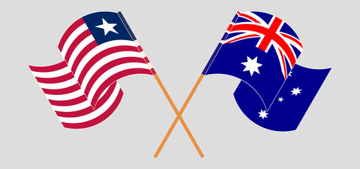 Crossed and waving flags of Liberia and Australia