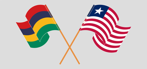 Crossed and waving flags of Mauritius and Liberia