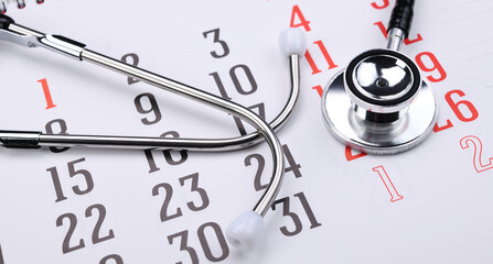 Stethoscope with calendar page date. Doctor appointment medical concept 