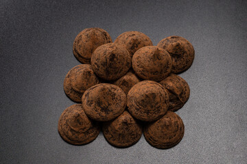 Chocolate truffles on a black background.