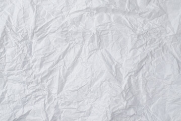 Crumpled white paper background.