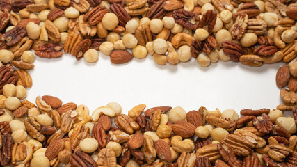 Mix of nuts isolated on white background. Top view.