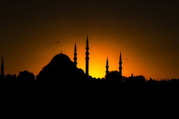 Islamic background photo. Silhouette of Suleymaniye Mosque at sunset.