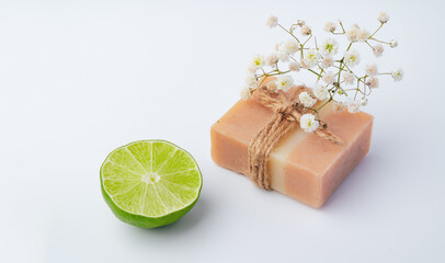 Handmade soap with lime on a white background.
