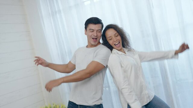 couple dancing at home