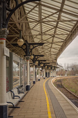 Curving railway platform.
