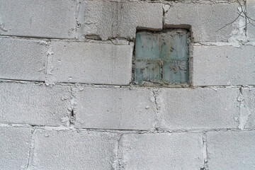 Windows on the wall of an industrial facility.