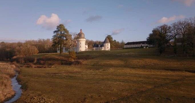 Aerial shot of the castle of the Gu&eacute; P&eacute;an by sunset in Monthou-sur-Cher, next to the Loire Valley, in France.