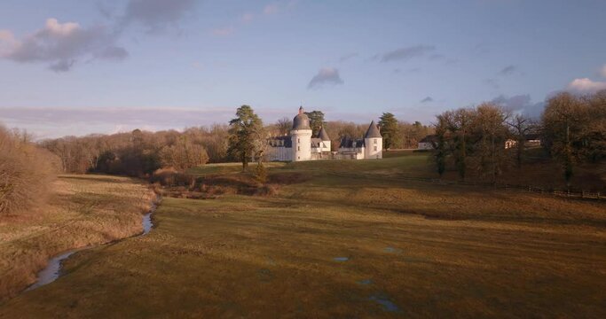 Aerial shot of the castle of the Gu&eacute; P&eacute;an by sunset in Monthou-sur-Cher, next to the Loire Valley, in France.