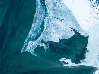 Aerial drone view on ice floes on ocean surface in Norways arctic sea