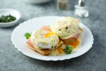Traditional homemade Benedict eggs with ham