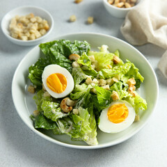 Healthy green salad with cashew and hard boiled eggs	