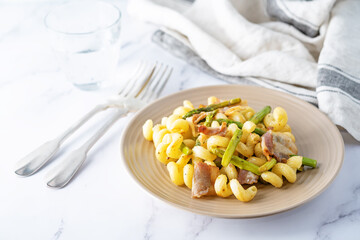 Fried Bacon roasted asparagus pasta in a plate