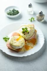 Traditional homemade Benedict eggs with ham