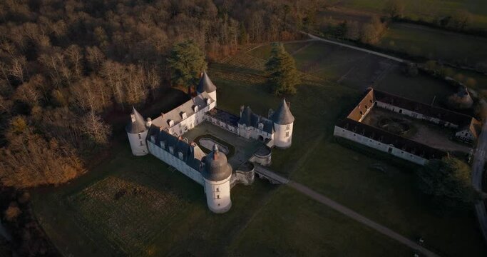 Aerial shot of the castle and stable of the Gu&eacute; P&eacute;an by sunset in Monthou-sur-Cher, next to the Loire Valley, in France.