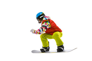 Portrait of young woman in bright sportswear, goggles and helmet snowboarding isolated on white...