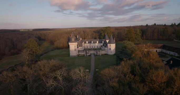 Aerial shot of the castle of the Gu&eacute; P&eacute;an by sunset in Monthou-sur-Cher, next to the Loire Valley, in France.