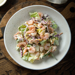 Green salad with shrimps and mayo dressing