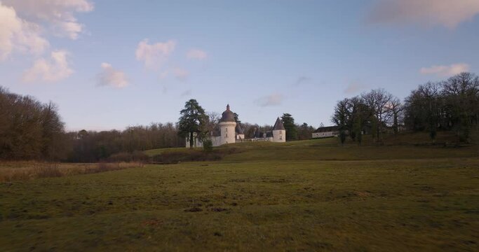 Aerial shot of the castle of the Gu&eacute; P&eacute;an by sunset in Monthou-sur-Cher, next to the Loire Valley, in France.