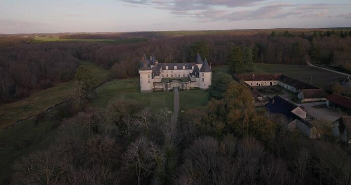 Aerial shot of the castle of the Gu&eacute; P&eacute;an by sunset in Monthou-sur-Cher, next to the Loire Valley, in France.