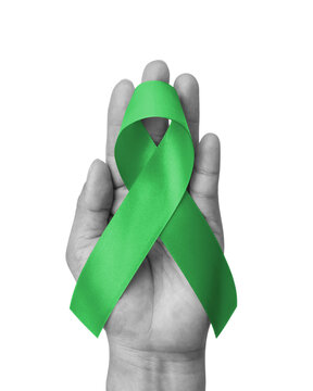 Green ribbon for gallbladder and bile duct cancer awareness month in February, bipolar disorder, mental health illness with kelly green bow isolated on white background with clipping path