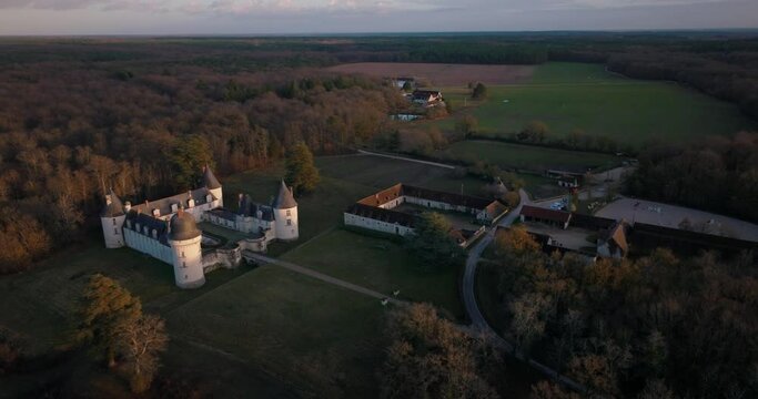Aerial shot of the castle and stable of the Gu&eacute; P&eacute;an by sunset in Monthou-sur-Cher, next to the Loire Valley, in France.