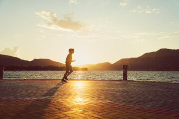 Man Jogging Along The Lakeside