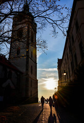 view of the sunset between the church and the castle Mělník in the Czech Republic  - 478790536