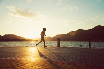 Man Jogging Along The Lakeside