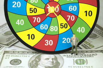 Figures Model Businessman ,Archery target,score and dollar.Concept goals and business success.