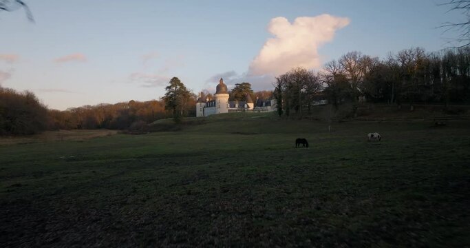 Aerial shot of the castle of the Gu&eacute; P&eacute;an by sunset in Monthou-sur-Cher, next to the Loire Valley, in France.