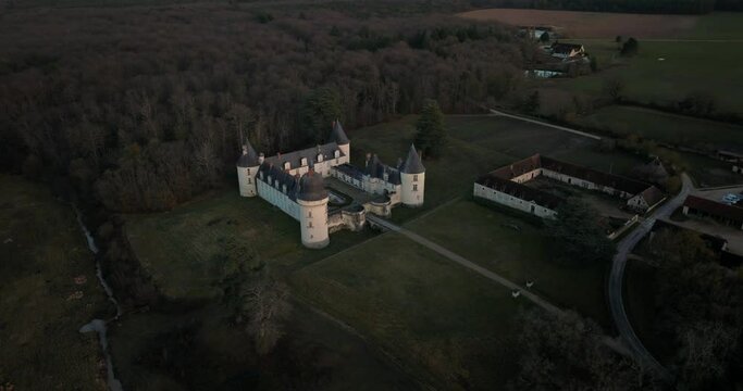 Aerial shot of the castle and stable of the Gu&eacute; P&eacute;an by sunset in Monthou-sur-Cher, next to the Loire Valley, in France.
