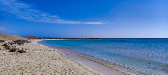 View of Sharm el Luli beach in Egypt. Red Sea and white sand. Blue water and sky