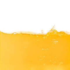 Yellow water surface with splash and air bubbles .