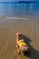 A girl on the beach of Koh Rong Island, Cambodia 